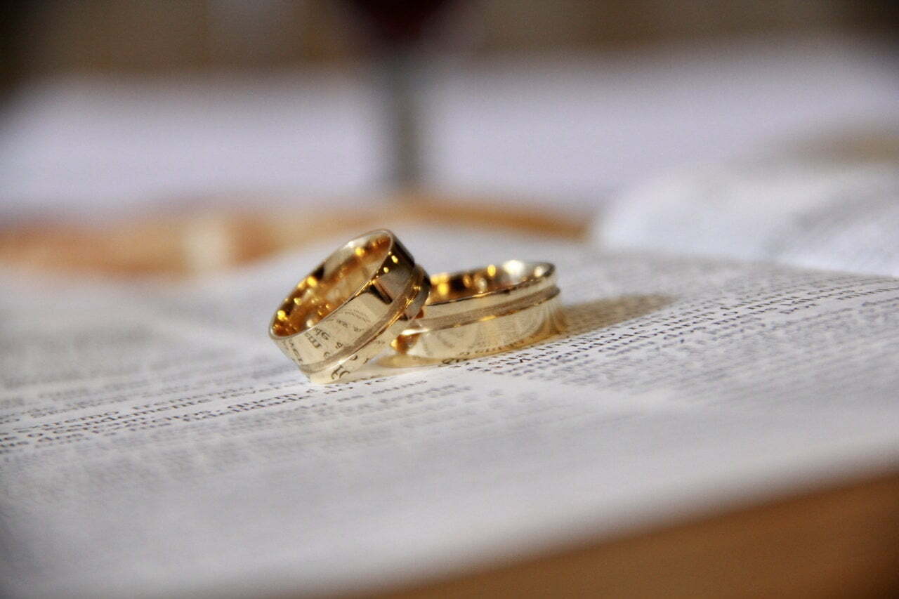 a small gold and black ring