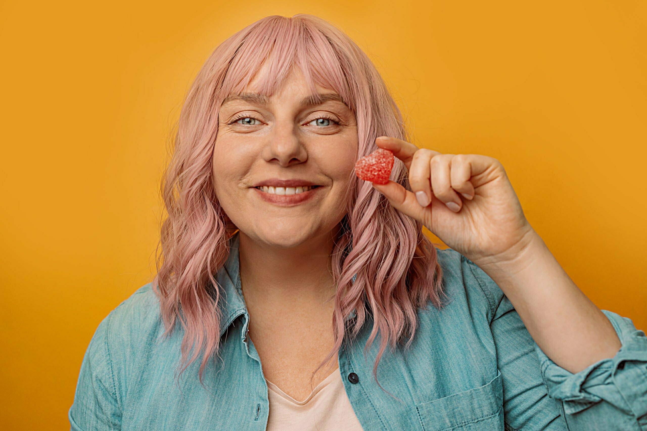 a woman holding a red object